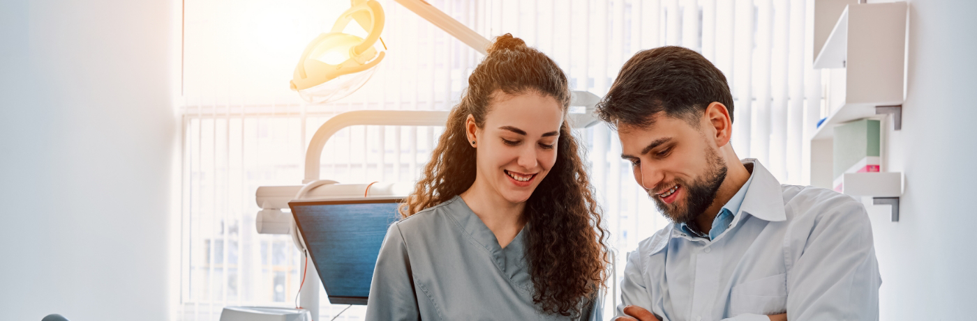 Dentist and patient looking at something